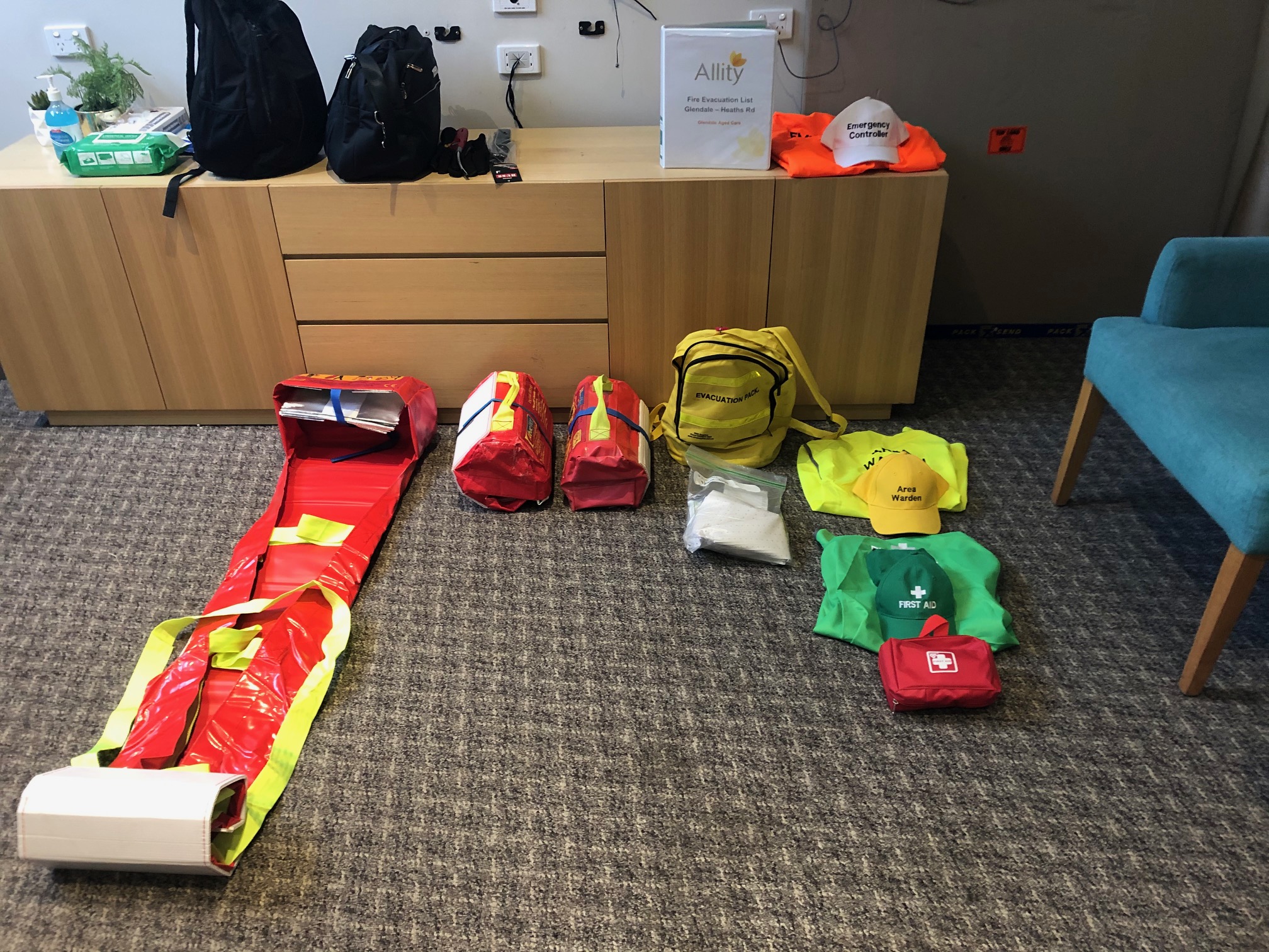 Warden vests, caps and first aid kits laid out ready for use
